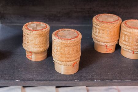 Thai sticky rice in a bamboo wooden old fashioned style boxの写真素材