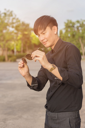 Asian man casual outfits standing in jeans and black denim shirt, men black.の写真素材