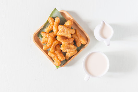 Cup of soybean milk with deep fried dough stick on the table  healthy for breakfast.
