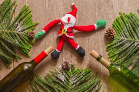 Christmas composition. Christmas gift, knitted blanket, pine cones, fir branches on woodenの写真素材