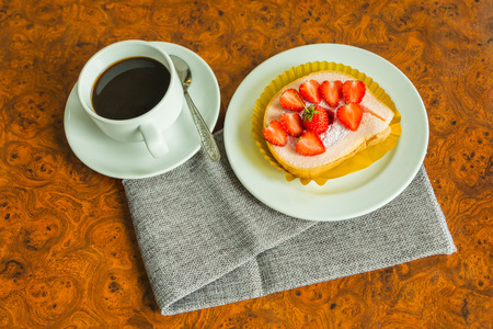 Cake and strawberries on wood background.の写真素材