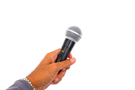 Microphone in hand on white background.の写真素材