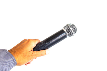 Microphone in hand on white background.の写真素材