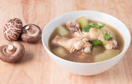 Chicken soup, chicken soup in a cup on wooden background.の写真素材