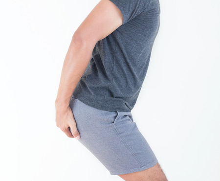 Young man has pain in the butt, Hemorrhoids, Anal disorders.の写真素材