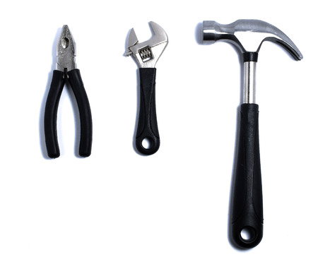 pliers,adjustable wrench and hammer isolated On White Background