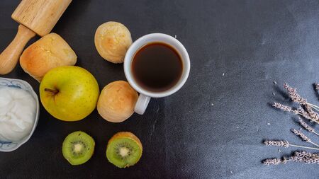 Black coffee and bakery in black background. Healthy breakfast in beautiful set up. coffee lover,の写真素材