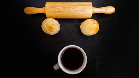 Black coffee and bakery in black background. Healthy breakfast in beautiful set up. coffee lover,の写真素材