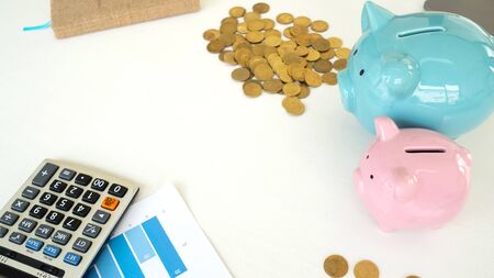 piggy bank and stake coins and calculator in white background. saving money for new car. copy space
