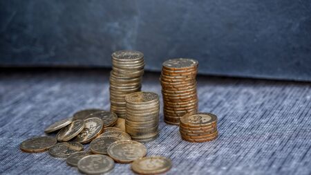 piggy bank in black background, coins stacks, saving money for investment concept. copy space
