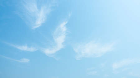 Abstract thin, white, wispy of clouds are streak across the sky,  Stunning springtime weather. beautiful clouds footageの写真素材