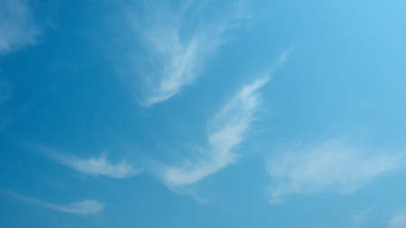 Abstract thin, white, wispy of clouds are streak across the sky,  Stunning springtime weather. beautiful clouds footageの写真素材
