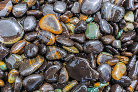 Flat shiny stones on the beach in Lipe. Thailandの写真素材