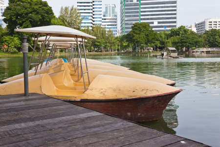 yellow bicycle boat in parkの写真素材