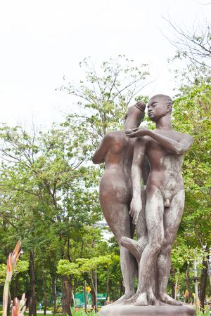 man and woman statue in gardenの写真素材