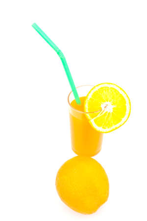 orange juice in glass over white paperの写真素材
