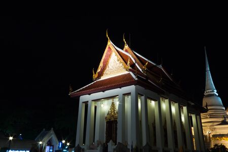 buddhist church at night time in Thailandの写真素材