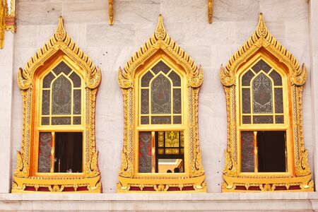 The window of Buddhist church at wat benchamaborphit in Thailandの写真素材