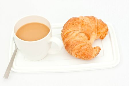 Delicious bread and cup of coffee on white paperの写真素材