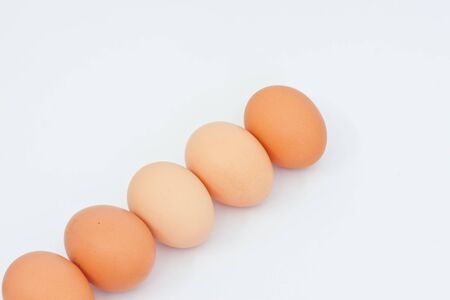 Many eggs  on white paperの写真素材