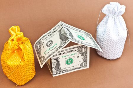 two money bag with dollarsの写真素材