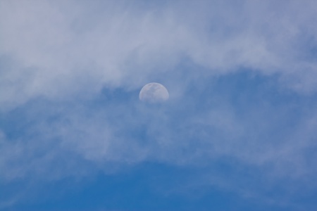 the moon on day time with blue skyの写真素材
