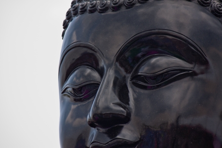 face of Buddha statue in thailandの写真素材