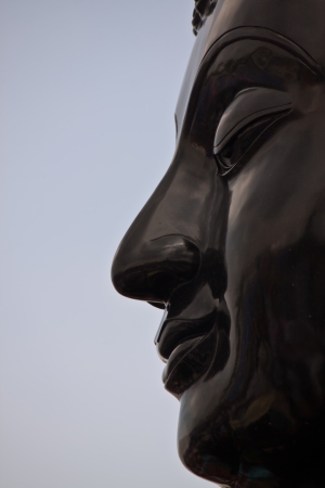 face of Buddha statue in thailandの写真素材