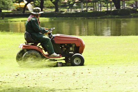 The gardener was mowing