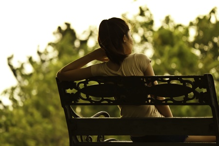 alone lady in gardenの写真素材