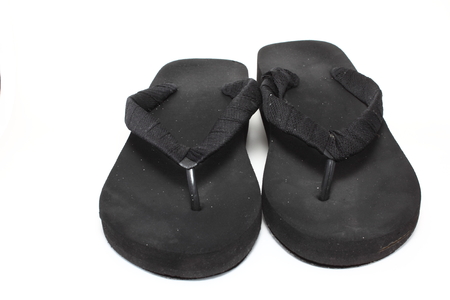 black slipper on white backgroundの写真素材