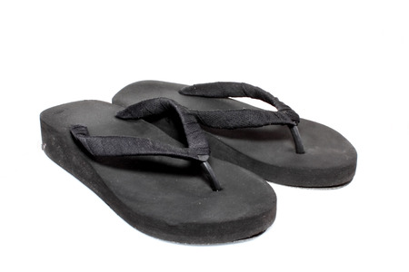 black slipper on white backgroundの写真素材