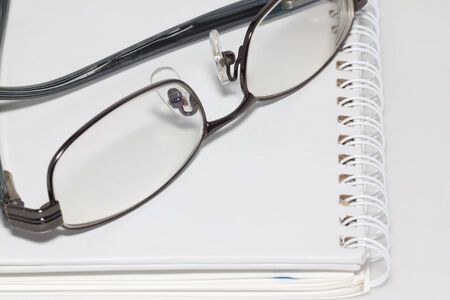 the eyeglass on notebookの写真素材