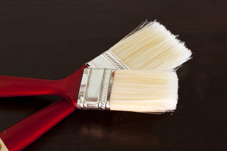 paintbrush on wood backgroundの写真素材
