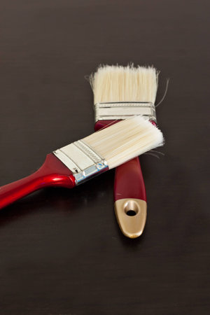 paintbrush on wood background