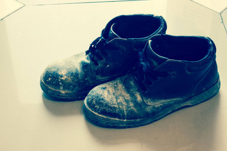 old shoe on floorの写真素材