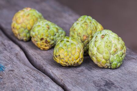 custard apple on wood backgroundの写真素材