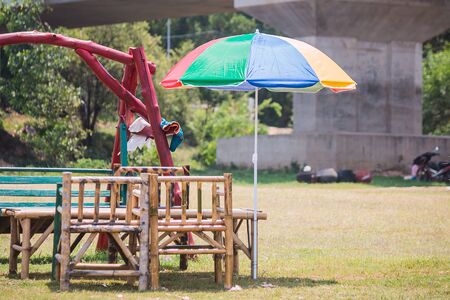 colorful umbrella with benchの写真素材