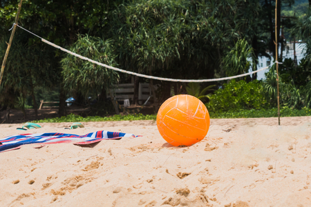 orange Volleyball on beachの写真素材