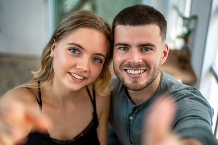 Young couple showing love and embracing happilyの写真素材