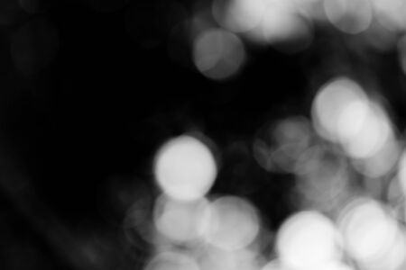 blurred bokeh lights on black loop backgroundの写真素材