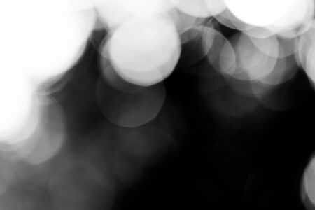 blurred bokeh lights on black loop backgroundの写真素材