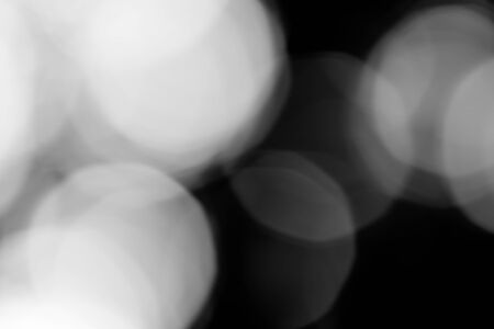 Abstract black bokeh backgroundの写真素材