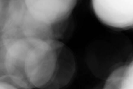 Abstract black bokeh backgroundの写真素材