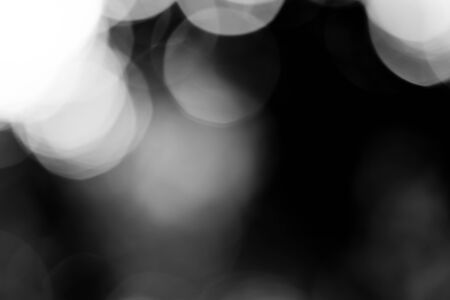 Abstract black bokeh backgroundの写真素材