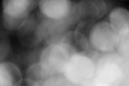 Abstract black bokeh backgroundの写真素材