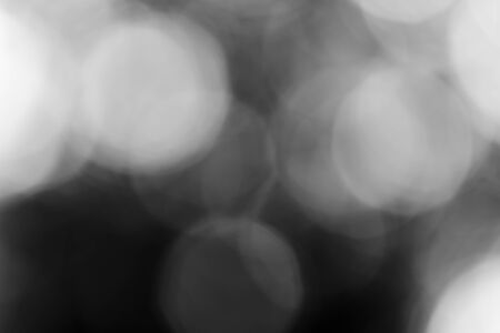 Abstract black bokeh backgroundの写真素材