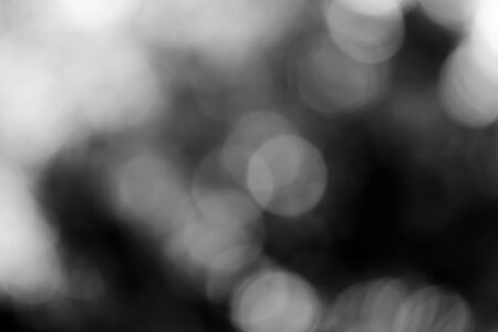 Abstract black bokeh backgroundの写真素材