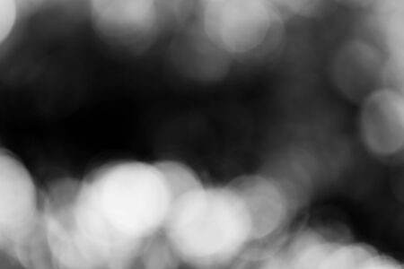 Abstract black bokeh backgroundの写真素材