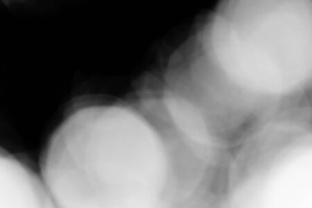 Abstract black bokeh backgroundの写真素材